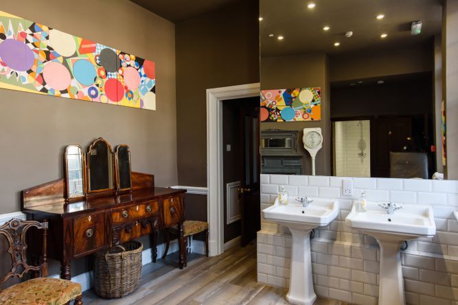 The getting-ready room with twin basins and a Victorian vanity